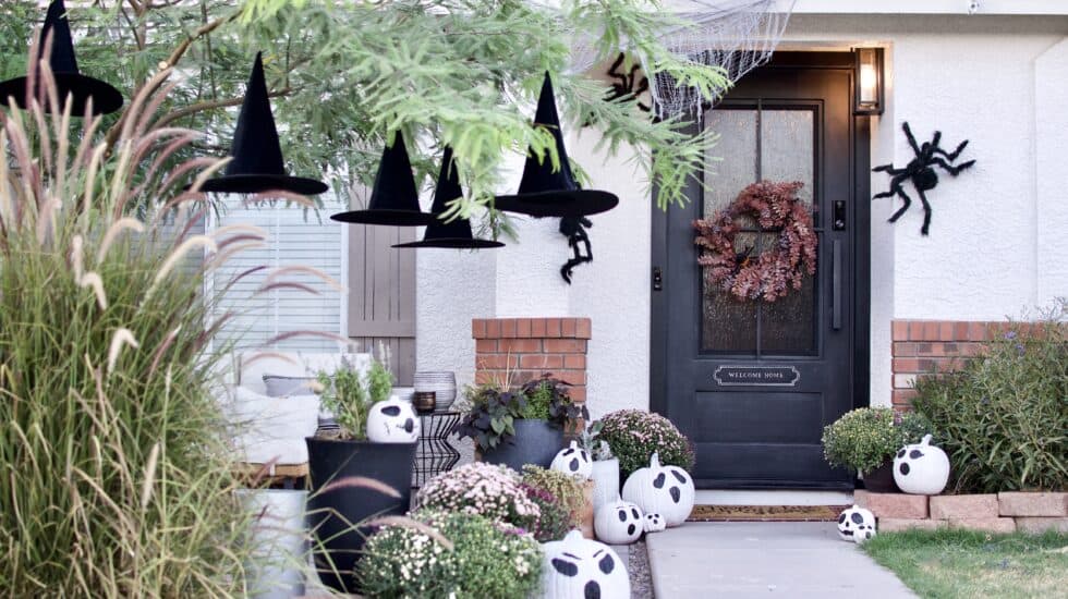 Giant Spiders on House. Floating Witch Hats.