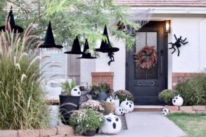 Giant Spiders on House. Floating Witch Hats.